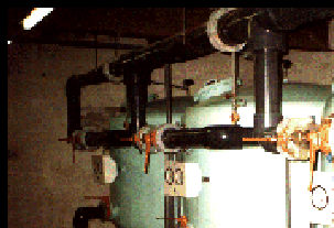 Photograph of three large filters at big school pool